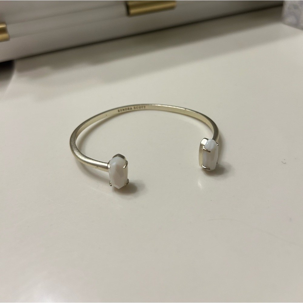 GOLD KENDRA SCOTT CUFF BRACELET WITH WHITE STONES
